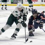 Everetts Bryce Kindopp controls the puck with Kamloops Montana Onyebuchi defending Sunday afternoon at Angel of the Winds Arena in Everett on February 18, 2018. The Silvertips won 4-0. (Kevin Clark / The Daily Herald)