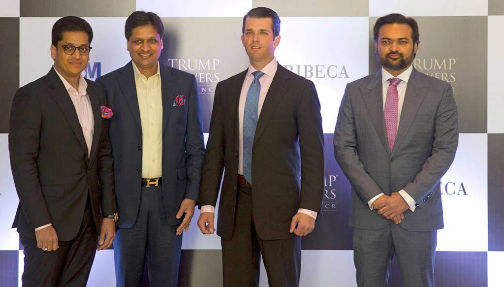 The eldest son of U.S. President Donald Trump, Donald Trump Jr. (second from right), poses with promoters of Trump Towers Pankaj Bansal (left) Basant Bansal of M3M developers and Kalpesh Mehta (right) of Tribeca developers at a photocall in New Delhi, India, on Tuesday. (AP Photo/Manish Swarup)