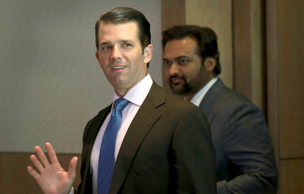 Donald Trump Jr. waves to media as he arrives for a meeting in New Delhi, India, on Tuesday. (AP Photo/Manish Swarup)