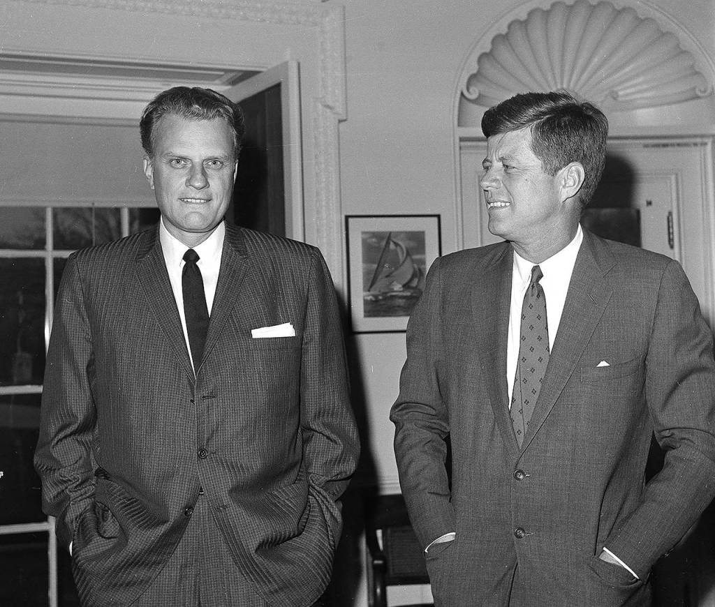 In this Dec. 12, 1961 photo, Evangelist Billy Graham (left) talks with President John F. Kennedy during a call at the the White House in Washington. (AP Photo, File)