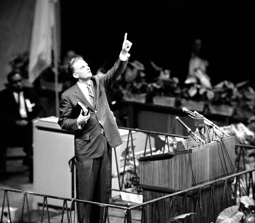 Evangelist Billy Graham is shown speaking at Madison Square Garden in New York City on May 15, 1957, as he opens his crusade for A Spiritual Revolution in the City. (AP Photo)