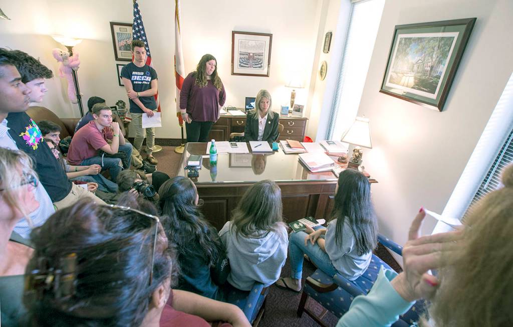 Florida Sen. Debbie Mayfield (center) listens as student survivors from Marjory Stoneman Douglas High School tell their personal experiences in her office at the Florida Capitol in Tallahassee. (AP Photo/Mark Wallheiser)