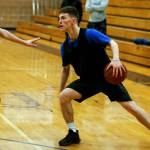 Kamiaks Carson Tuttle dribbles during a team practice at the Mukilteo school on Friday, Feb. 23. (Ian Terry / The Herald)
