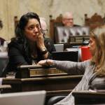 Rep. Kristine Reeves, D-Federal Way, battled tears during the House floor debate on a bill to ban bump stocks, while her colleague Tana Senn, D- Mercer Island, turned to comfort her. (Taylor McAvory/WNPA Olympia Bureau)