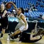 Lake Stevens Kylee Griffen (center) falls as shes guarded by Kentlakes Kiernen Denckla (right) during a girls 4A state tournament game at the Tacoma Dome on Wednesday, Feb. 28. Kentlake went on to defeat Lake Stevens 57-42. (Ian Terry / The Herald)