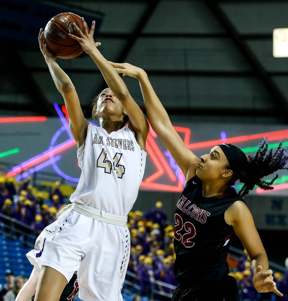 Lake Stevens Kylee Griffen (44) takes a shot as Kentlakes Desiree Lane (22) defends during a girls 4A state tournament game at the Tacoma Dome on Wednesday, Feb. 28. Kentlake went on to defeat Lake Stevens 57-42. (Ian Terry / The Herald)