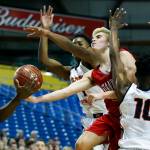 Stanwoods Nate Kummer (center right) has the ball stolen by Eastside Catholics Orlando Ashford (left) along with Shane Nowell (center) Syon Blackmon (right) during a boys 3A state tournament game at the Tacoma Dome on Wednesday, Feb. 28. Eastside Catholic went on to defeat Stanwood 63-37. (Ian Terry / The Herald)