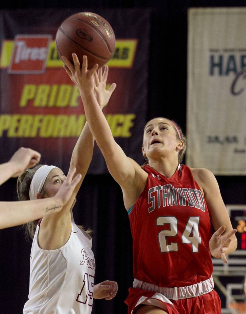 Stanwoods Jillian Heichel (right) attempts a shot with Prairies Cassidy Gardner defending during a 3A Hardwood Classic game on Feb. 28, 2018, at the Tacoma Dome. (Kevin Clark / The Herald)