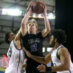 Kamiaks Conner Fitzpatrick (center) attempts a shot with Unions Zach Reznick (left) and Unions Alishawuan Taylor (right) defending during the 4A Hardwood Classic on Feb. 28, 2018, at the Tacoma Dome. (Kevin Clark / The Herald)