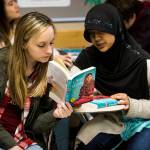 Cascade High School students Ashlyn Murphy (left) and Rosita Rasyid discuss a passage of Malala Yousafzais book I Am Malala during one of Jennifer Dow Himstedts sophomore English classes at the Everett school on Feb. 27. (Ian Terry / The Herald)