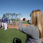 Drayer takes photos and video with her phone of the Mariners during spring training. (Ben VanHouten/ Seattle Mariners)