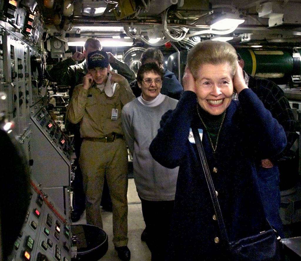 Helen Jackson holds her ears after firing a water slug out of a torpedo shaft aboard the Trident nuclear submarine USS Henry M. Jackson, named after her late husband, Sen. Henry M. Scoop Jackson, in 1999. The submarine was in Bremerton celebrating its 50th Strategic Deterrent Patrol. (Herald file / Justin Best)