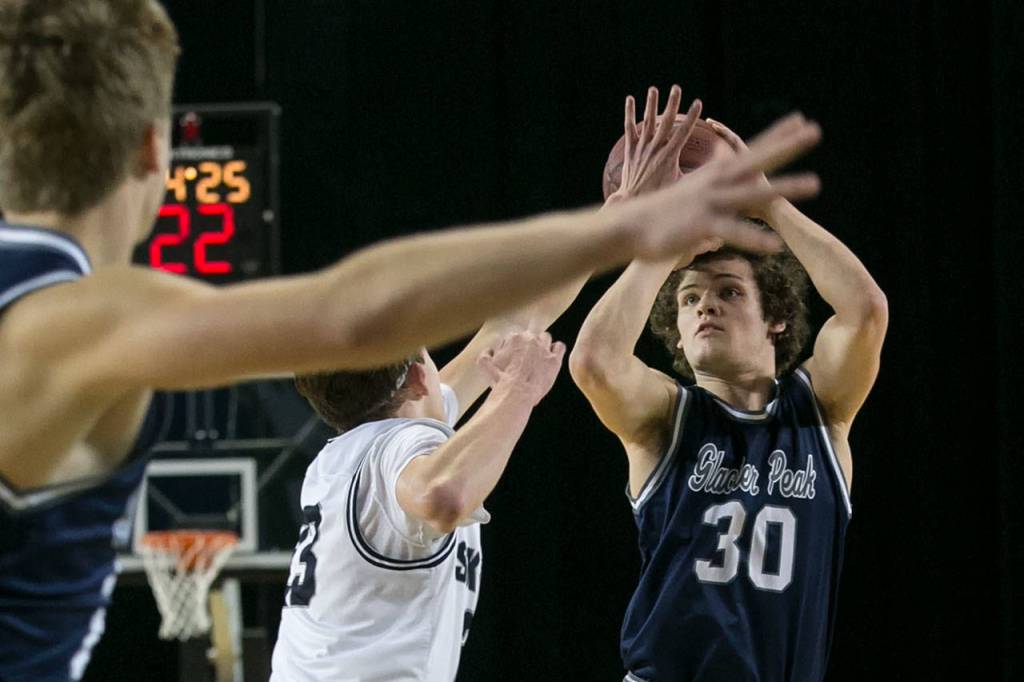 Glacier Peaks Bobby Martin attempts a shot over Skyviews Kyle Gruhler during the WIAA state basketball tournament Wednesday at the Tacoma Dome in Tacoma on February 28, 2018. (Kevin Clark / The Daily Herald)