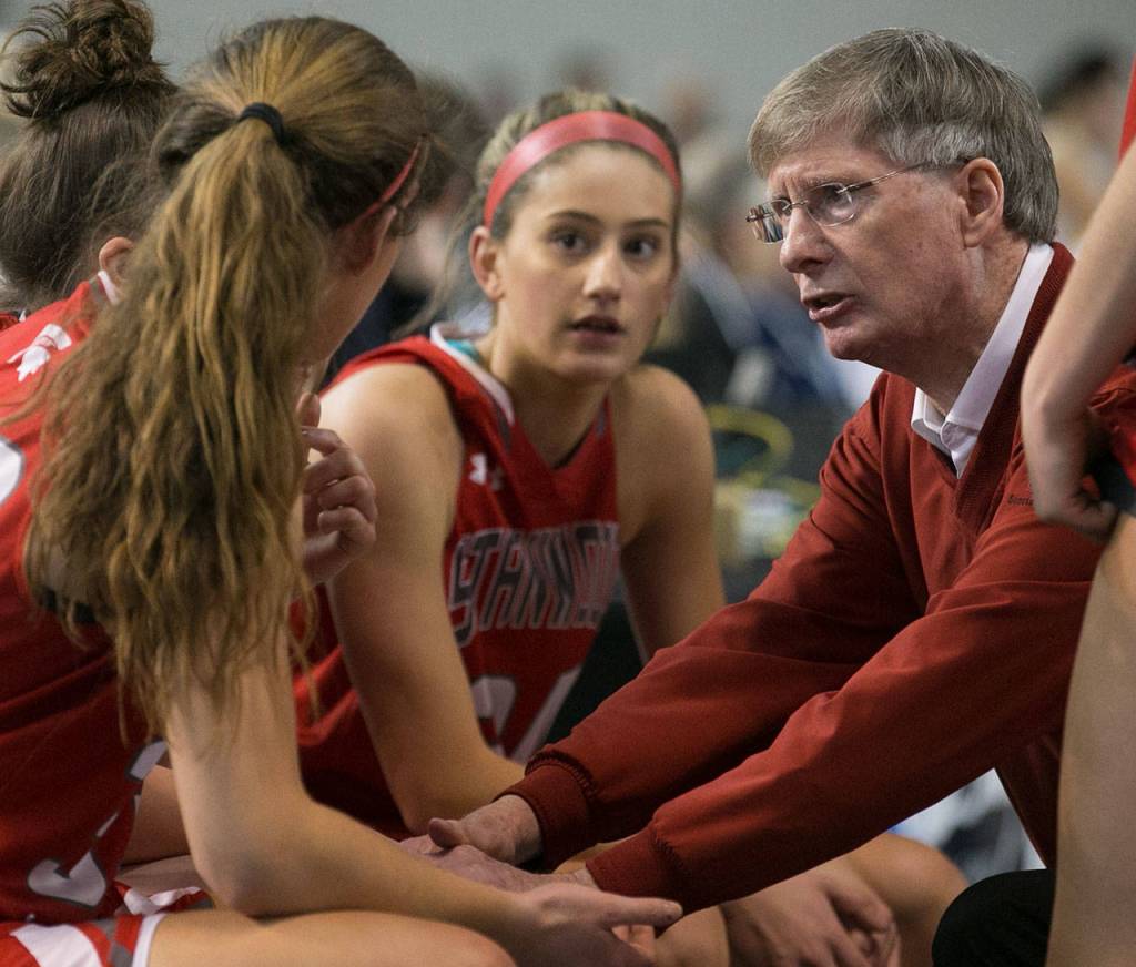 Stanwoods head coach, Dennis Kloke addresses his team during a timeout during the WIAA state basketball tournament Wednesday at the Tacoma Dome in Tacoma on February 28, 2018. (Kevin Clark / The Daily Herald)