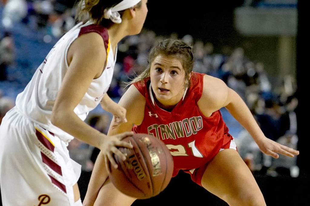 Stanwoods Madison Chisman defends against Prairies Allison Corral during the WIAA state basketball tournament Wednesday at the Tacoma Dome in Tacoma on February 28, 2018. (Kevin Clark / The Daily Herald)