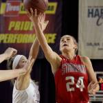 Stanwoods Jillian Heichel attempts a shot with Prairies Cassidy Gardner defending during the WIAA state basketball tournament Wednesday at the Tacoma Dome in Tacoma on February 28, 2018. (Kevin Clark / The Daily Herald)