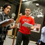 Kamiak High School students (from left) Teddy Kouthong, Jack Burrows and Eddie Kouthong practice lines from Spamalotafter school on Thursday in Mukilteo. (Ian Terry / The Herald)