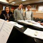 Under the direction of music director Nancy Duck-Jefferson (not pictured), Kamiak High School students (from left)Kennedy Miller, Aidan Norris, Gavin McKeever and Mitchell Beard rehearse the song Always Look On The Bright Side of Life from Spamalot.(Ian Terry / The Herald)
