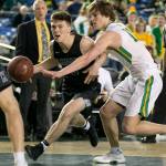 Kamiaks Carson Tuttle drives with Richlands Cody Sanderson defending during a 4A boys Hardwood Classic game on March 1, 2018, at the Tacoma Dome. (Kevin Clark / The Herald)