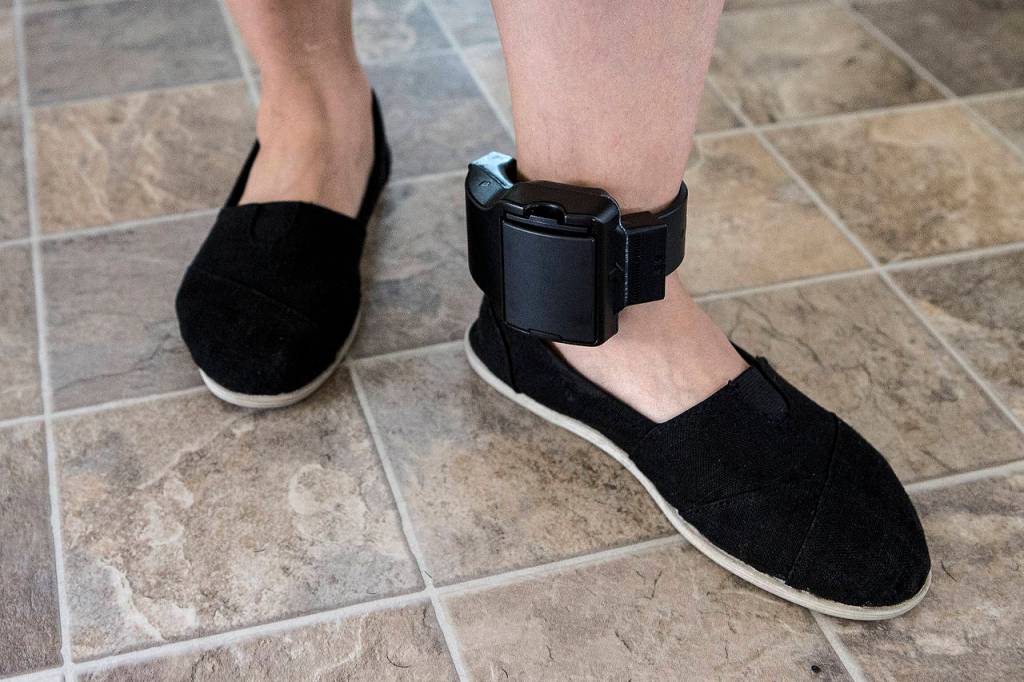 Bernarda Pineda wears an ankle monitor at her home in Marysville on March 3. A native of Honduras, Pineda was told Feb. 20 that she was being deported back to her home country. (Ian Terry / The Herald)