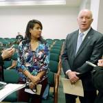 Steven Strachan (third from left), executive director of the Washington Association of Sheriffs and Police Chiefs, talks to reporters along with Leslie Cushman (far left) and Heather Villanueva (second from left), both of De-Escalate Washington, on Tuesday in Olympia after a House hearing on the use of deadly force by law enforcement officers. (Ted S. Warren / Associated Press)