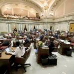 Members of the Washington Senate work on legislation Tuesday at the Capitol in Olympia. (Ted S. Warren / Associated Press)