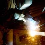 A welder fabricates a steel structure at an iron works facility in Ottawa, Ontario, on Monday. (Sean Kilpatrick/The Canadian Press via AP)