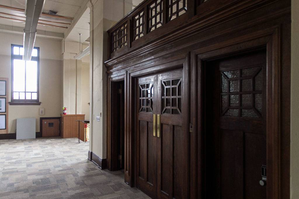 Original woodwork that remains in the Carnegie library building is due for renovation. (Kevin Clark / The Herald)