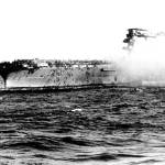 In this 1942 file photo, the crew abandons the USS Lexington after the decks of the aircraft carrier sunk in the Battle of the Coral Sea during World War II. A piece of prized World War II U.S. naval history, the wreckage of the aircraft carrier USS Lexington, which was sunk by the Japanese in a crucial sea battle, was discovered by an expedition funded by Microsoft co-founder Paul Allen on March 4. (U.S. Navy via AP)