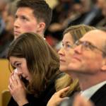 Jack Laurence (left-right) Julia Laurence, Anna Marie Laurence and Dan Laurence watch a slide show of the life and times of Helen Jackson Saturday afternoon at First Presbyterian in Everett on March 24, 2018. (Kevin Clark / The Daily Herald)