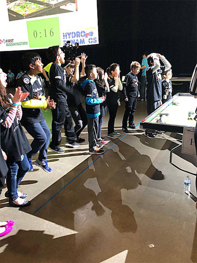 The Cedar Wood Elementary School robotics team cheers at an earlier FIRST Lego League qualifying competition in January. (Contributed photo)