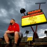 Pacific Stone Company manager James Martin might be enjoying an unseasonably warm morning Tuesday in the 3800 block along Evergreen Way in Everett, but it doesnt have anything to do with the message on his sign, Dont Forget to Open. That phrase, which will appear this week on numerous signs along this busy route, is the brainchild of Khadija Tarver. She is honoring her late father. Jason Tarver, who died March 14, 2015, wrote her letters that had Dont Forget to Open written on the envelope. (Dan Bates / The Herald)