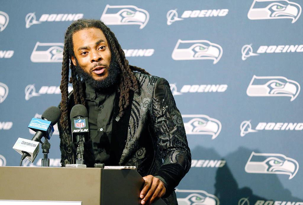 Seattle Seahawks cornerback Richard Sherman talks to reporters during a post-game press conference last season in Seattle. The team has informed him that he will be released. (AP Photo/Stephen Brashear, File)