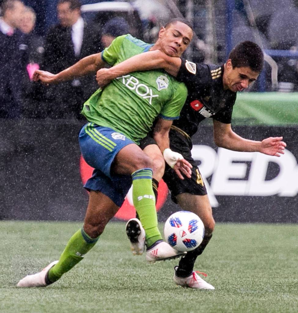 Sounders midfielder Henry Wingo (left) vies for the ball with Los Angeles defender João Moutinho on the Xbox Pitch at CenturyLink Field in Seattle on March 4. Los Angeles FC won 1-0. (Kevin Clark / The Herald)