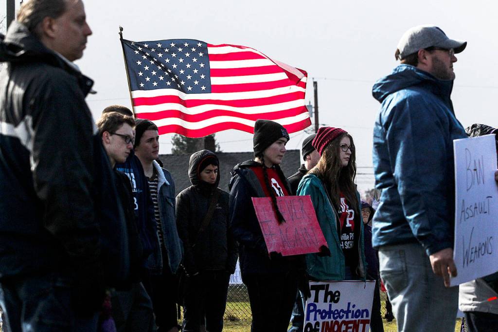 A crowd gathers at the Asbery Athletic Fields in Marysville for a March for Our Lives rally on Saturday. (Ian Terry / The Herald)
