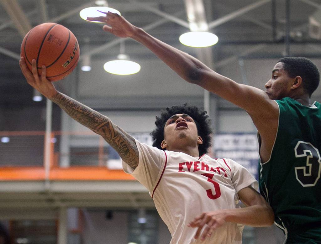 Everetts Markieth Brown Jr. attempts a shot with Chemeketas Eric McKinstry II defending during the NWAC Basketball Tournament at Everett Community College on March 10. (Kevin Clark / The Herald)