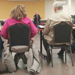 Cammy Hart-Anderson, of Snohomish County human services, updates the Delta Neighborhood Association on Tuesday about plans to put addiction treatment beds at a site on 10th Street in Everett. (Rikki King / The Herald)