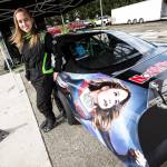 Brittney Zamora stands next to her Supergirl Super Late Model race car at the Evergreen Speedway. (Ian Terry / The Herald)
