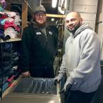 Washington Energy Services employees Carlos Del Rio and Jay Silva install a donated furnace at the nonprofit Clothes For Kids in Lynnwood. (Contributed photo)