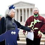 Helenmary Ball (left), of Calvert County, Maryland, and Bobby Bartlett were among nonpartisan groups protesting against gerrymandering in front of the Supreme Court on Wednesday. (AP Photo/Jacquelyn Martin)