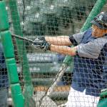 Elaine Thompson / Associated Press                                Seattles Ichiro Suzuki takes batting practice Wednesday at Safeco Field. Suzuki had been dealing with a sore calf during the past few days, but was deemed healthy enough to be placed on the Mariners opening-day roster.