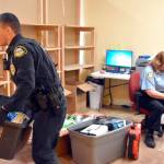 Monroe police raided a gold buying business Friday morning, two years into an investigation led by officer Nathan Erdmann (left). (Caleb Hutton / Herald)