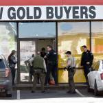 Monroe police raided a gold-buying business Friday morning north of Lynnwood. Officers had been investigating the owner for two years. He is suspected of trafficking in stolen goods. (Caleb Hutton / Herald)