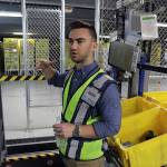 At the Amazon fulfillment center in Monee, Illinois, general manager Jeff Messenger talks about the robots in use there Wednesday. (Terrence James/Chicago Tribune)