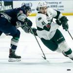 Everett forward Garrett Pilon (right) skates past Seattle defenseman Turner Ottenbreit (left) during a playoff game at Angel of the Winds Arena in Everett on Saturday, March 31. (Ian Terry / The Herald)