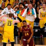 Michigans Moritz Wagner (13) celebrates with his teammates as Loyola-Chicagos Aundre Jackson (24) walks off during the second half of a Final Four game on March 31, 2018, in San Antonio. (AP Photo/Brynn Anderson)
