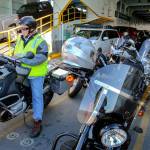 Kevin Richman reads while sitting on his motorcycle aboard a ferry on the Mukilteo-Clinton run. (Kevin Clark / The Herald)