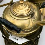 A tea pot was offered at a yard sale in Mukilteo on Friday. (Kevin Clark / The Herald)