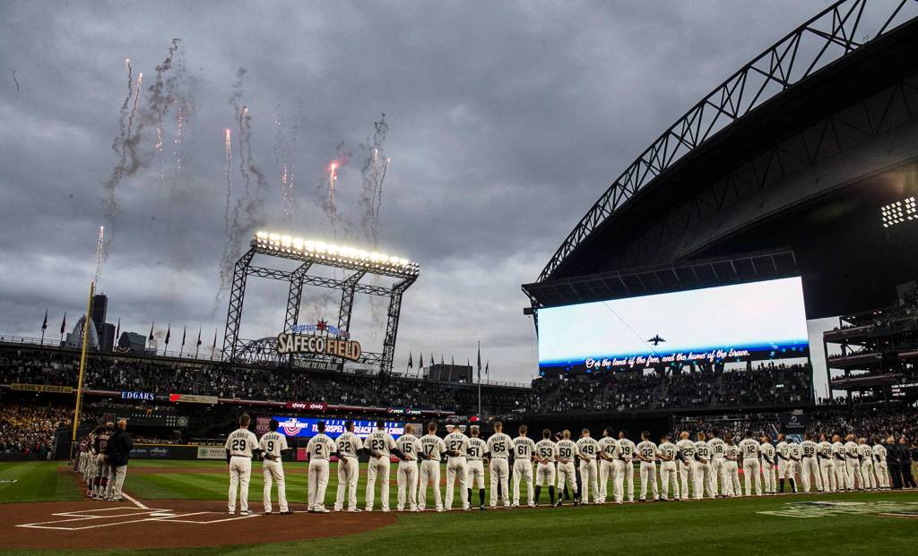 The opening ceremonies of the home opener against the Cleveland Indians at Safeco Field in Seattle on March 29. (Kevin Clark / The Herald)