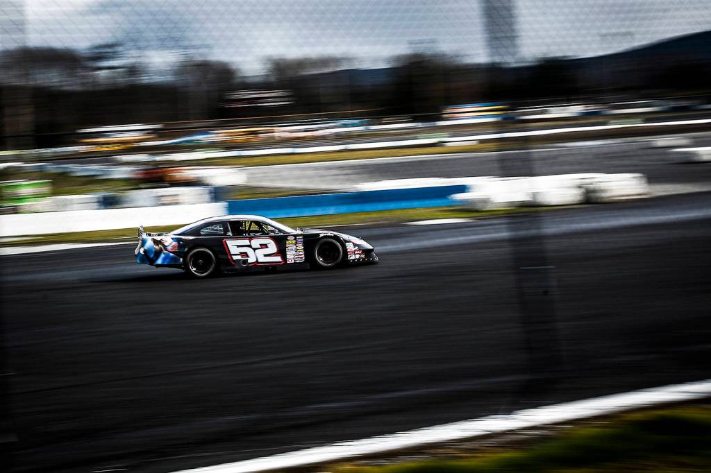 Practice takes place on a newly paved Evergreen Speedway race track in Monroe on March 24. Drivers expect faster races this upcoming season with the new track providing better grip. (Ian Terry / The Herald)